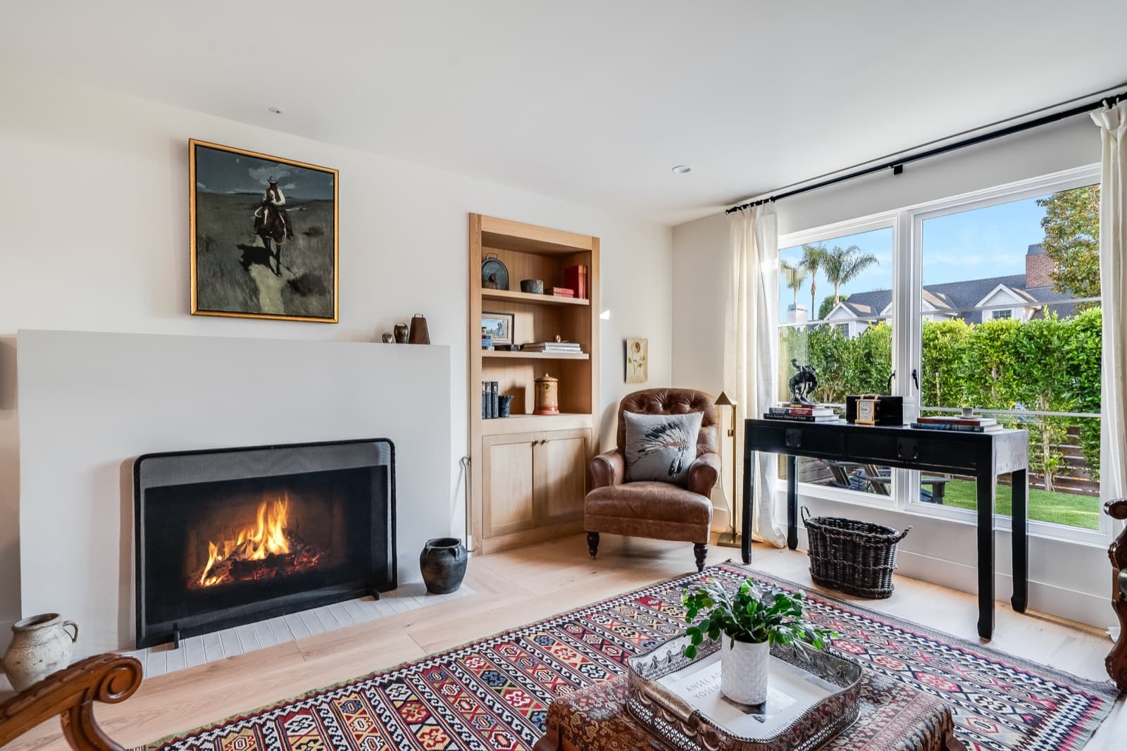 Finished living room with fireplace in a Templeton Custom Homes residence